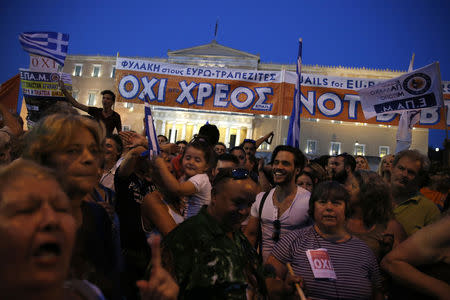 Protesters shout slogans in front of the parliament building during an anti-austerity rally in Athens, Greece, June 29, 2015. REUTERS/Alkis Konstantinidis