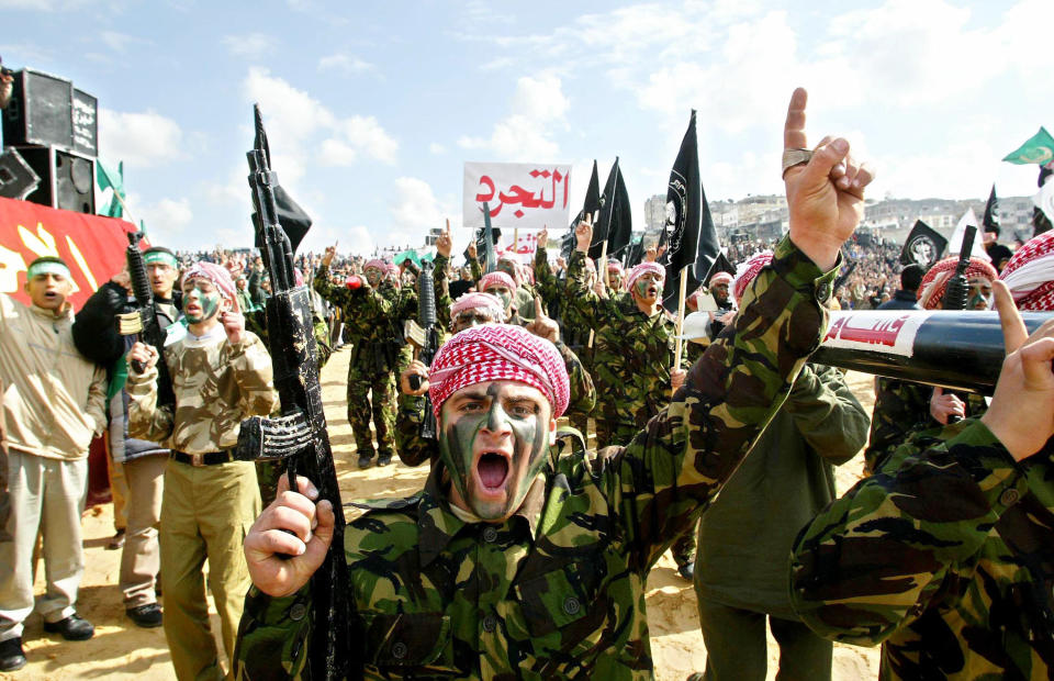 Hamas members shout anti-Israel and anti-U.S. slogans at a rally in 2003 on the anniversary of the death of the Muslim Brotherhood's founder.