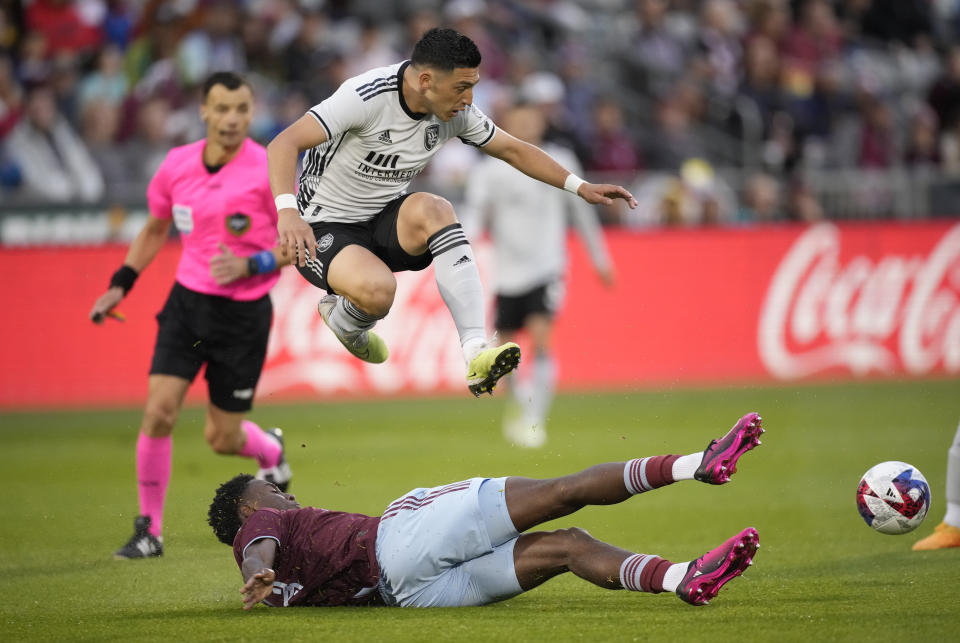 San Jose Earthquakes forward Cristian Espinoza hurdles Colorado Rapids defender Moïse Bombito during the first half of an MLS soccer match Saturday, June 3, 2023, in Commerce City, Colo. (AP Photo/David Zalubowski)