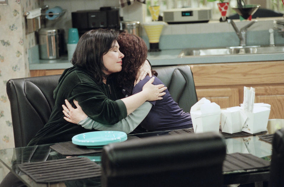 Roseanne Barr hugs her co-star Sara Gilbert during the last scene of the final taping of the ABC sitcom Roseanne, Friday, April 4, 1997 in Los Angeles. (AP Photo/Chris Pizzello)