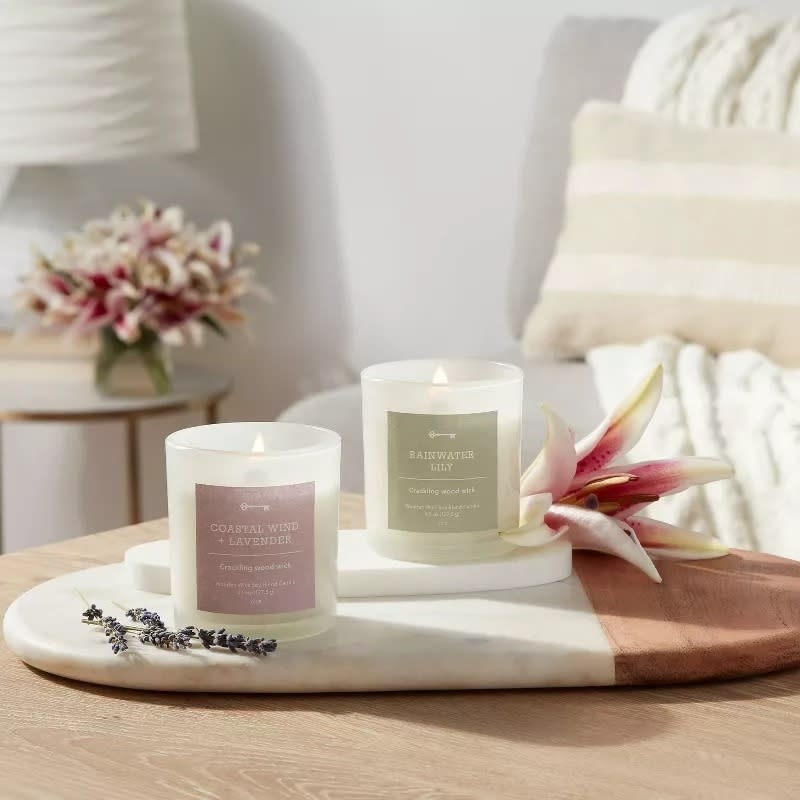 Two scented candles on a marble tray