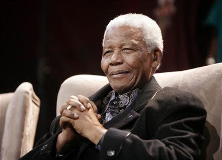 Former South African President Nelson Mandela attends the sixth Nelson Annual Mandela lecture in Kliptown, near Johannesburg, in this July 12, 2008 file photo. REUTERS/Mike Hutchings/Files