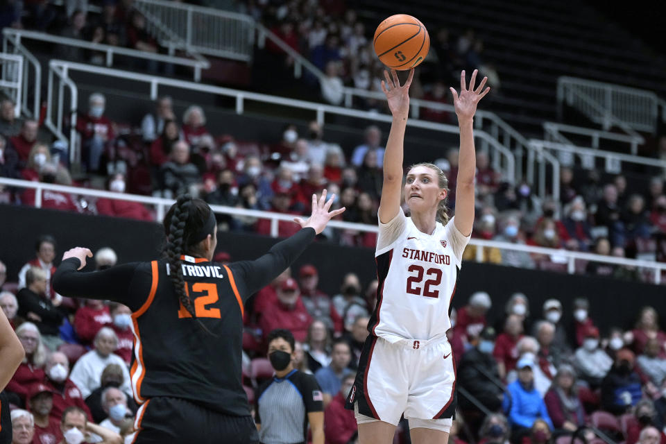 Stanford forward Cameron Brink (22) takes a 3-point shot over Oregon State forward Jelena Mitrovic (12) during the first half of an NCAA college basketball game Friday, Jan. 27, 2023, in Stanford, Calif. (AP Photo/Tony Avelar)