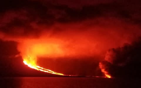 The La Cumbre volcano at the Fernandina Island, in Galapagos Archipelago, Ecuador erupts. - Credit: AFP