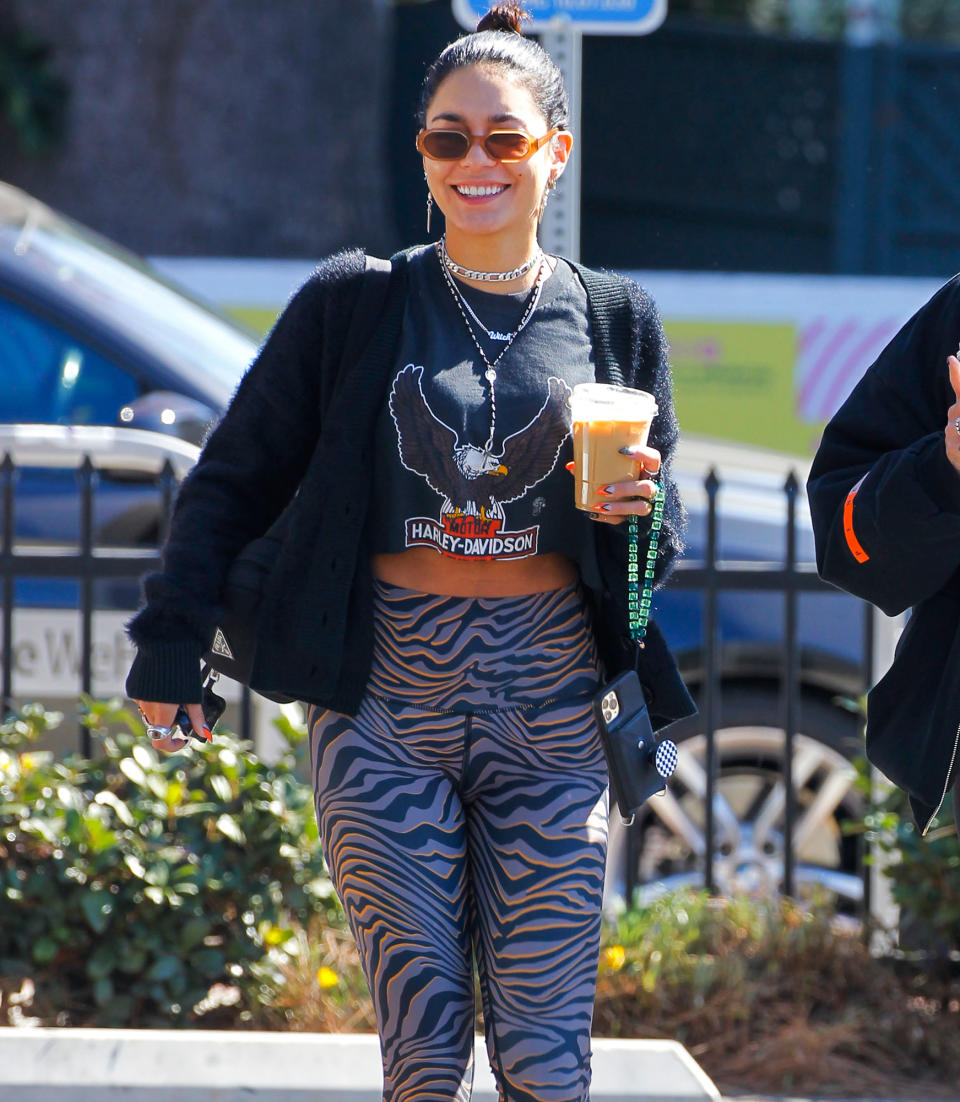 <p>Vanessa Hudgens grabs a coffee as she leaves the Dog Pound gym in L.A. on Oct. 13.</p>