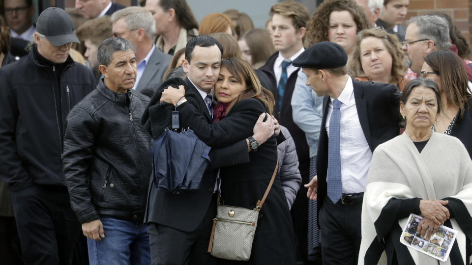 Friends and family gather following funeral services to remember a mother and three of her children who police say were killed by her teenage son Friday, Jan. 24, 2020, in Grantsville, Utah. Prosecutors say 16-year-old Colin "CJ" Haynie "methodically" killed his mother and siblings one by one as they returned home over a period of five hours on Jan. 17. Prosecutors have said the teenager shot his father in the leg before the older man wrestled a handgun away. (AP Photo/Rick Bowmer)