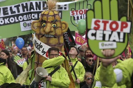 Consumer rights activists take part in a march to protest against the Transatlantic Trade and Investment Partnership (TTIP) and Comprehensive Economic and Trade Agreement (CETA) in Berlin, Germany, September 17, 2016. REUTERS/Fabrizio Bensch