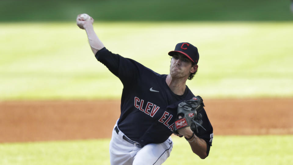 Cleveland Indians starting pitcher Shane Bieber delivers in the first inning in a baseball game against the Kansas City Royals, Friday, July 24, 2020, in Cleveland. (AP Photo/Tony Dejak)