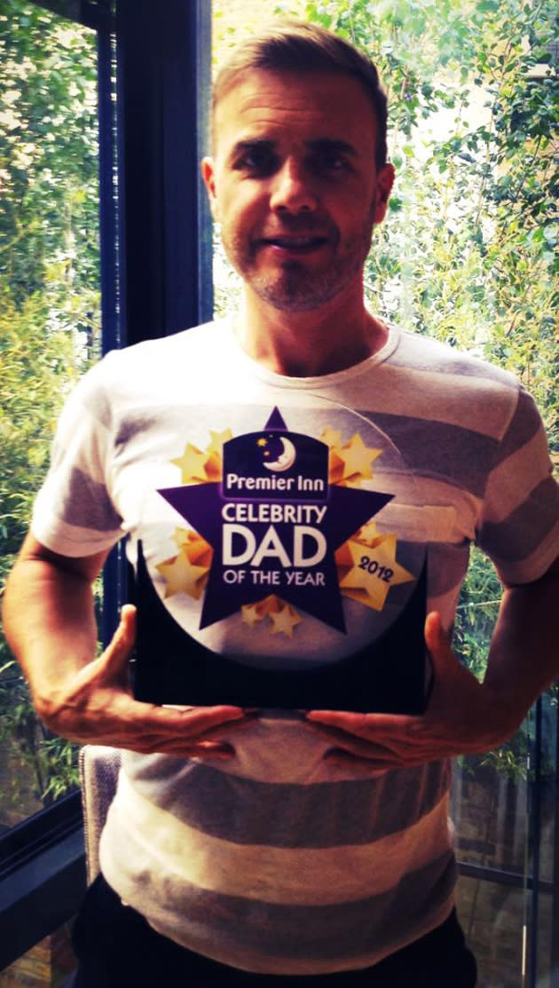 Celebrity photos: Gary Barlow was very proud of himself after winning Celebrity Dad of the Year, beating Peter Andre to the title. He tweeted this snap of him holding his award, announcing to followers: “Ladies,gentlemen,lads,lassies and Peter Andre, I'm proud to tell you all that I've won 'Celebrity Dad of the year 2012.” [sic]