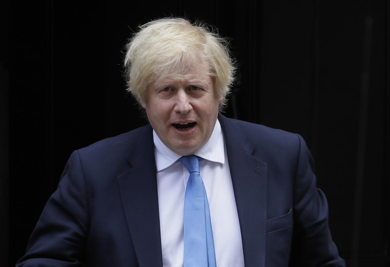 Britain's Prime Minister Boris Johnson leaves 10 Downing Street to attend the weekly session of Prime Ministers Questions in Parliament in London, Wednesday, June 17, 2020. (AP Photo/Kirsty Wigglesworth)