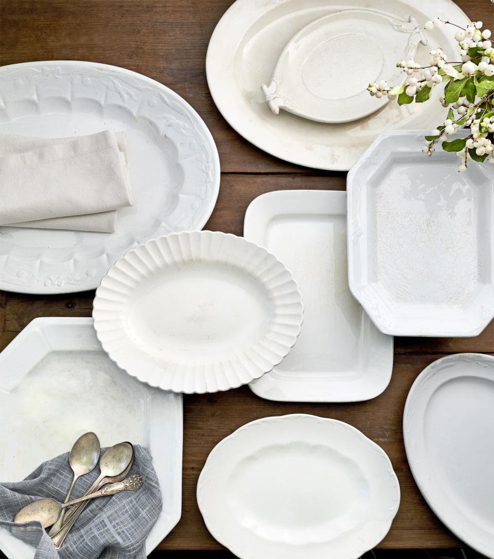 an arrangement of antique white ironstone platters