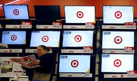 A shopper looks at a sales flier during Black Friday Shopping at a Target store in Chicago, Illinois, United States, November 27 , 2015. REUTERS/Jim Young