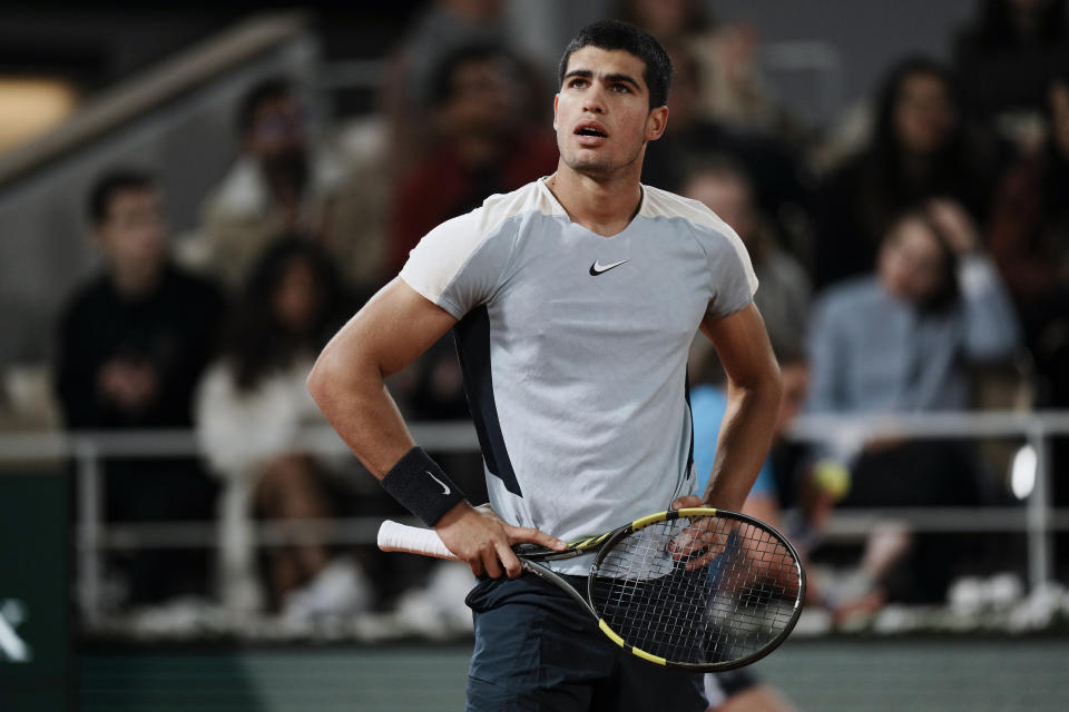 Spain's Carlos Alcaraz reacts after missing a shot against Russia's Karen Khachanov during their fourth round match at the French Open tennis tournament in Roland Garros stadium in Paris, France, Sunday, May 29, 2022. (AP Photo/Thibault Camus)