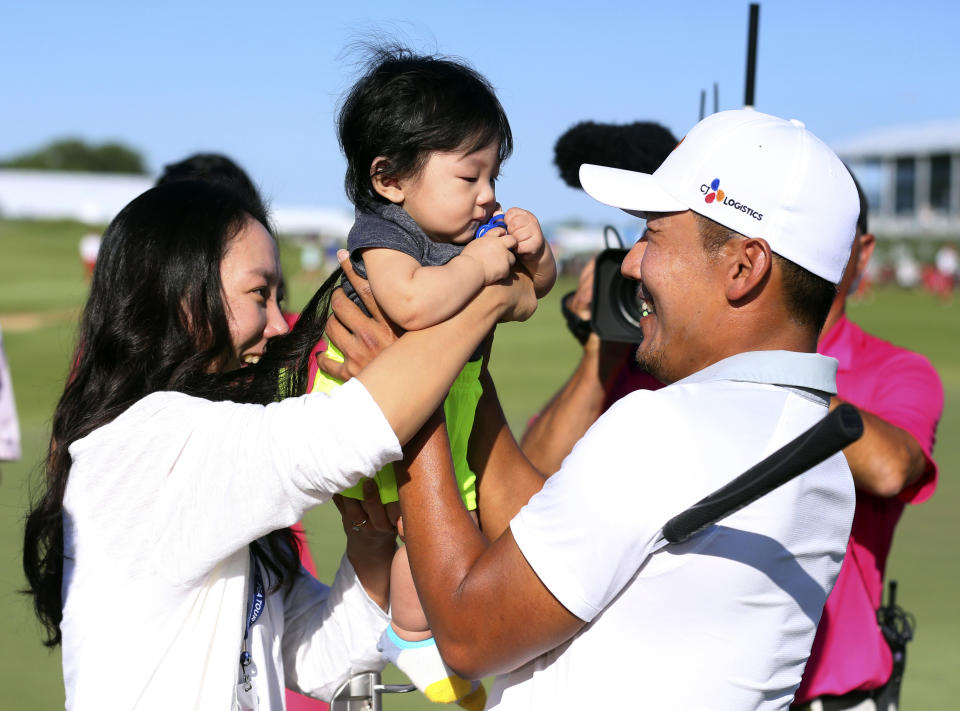 Sung Sang, right, celebrates with his wife Soyoung Yang and son Eugene Gunn Kang after winning the Byron Nelson golf tournament on Sunday, May 12, 2019, in Dallas. (AP Photo/Richard W. Rodriguez)