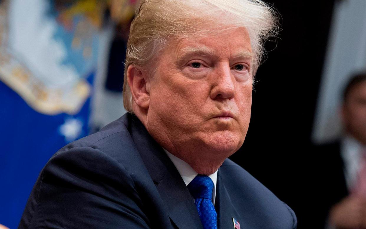 US President Donald Trump (L) listens during a meeting with Republican Members of the Senate about immigration at the White House in Washington, DC, on January 4, 2018 - AFP