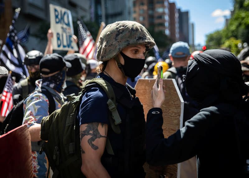 Protesters and counter-protesters face off against one another in Portland