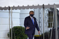 FILE - In this Oct. 2, 2020, file photo President Donald Trump waves to members of the media as he leaves the White House to go to Walter Reed National Military Medical Center after he tested positive for COVID-19 in Washington. Trump told the world that he and first lady Melania Trump had contracted COVID-19 in a tweet at 12:54 a.m. Friday. (AP Photo/Alex Brandon, File)