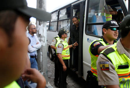 A Chinese crew member steps off a bus after being detained along with others for illegally fishing off the Galapagos Islands, in Puerto Baquerizo Moreno, San Cristobal, Ecuador August 25, 2017. Picture taken August 25, 2017. REUTERS/Daniel Tapia