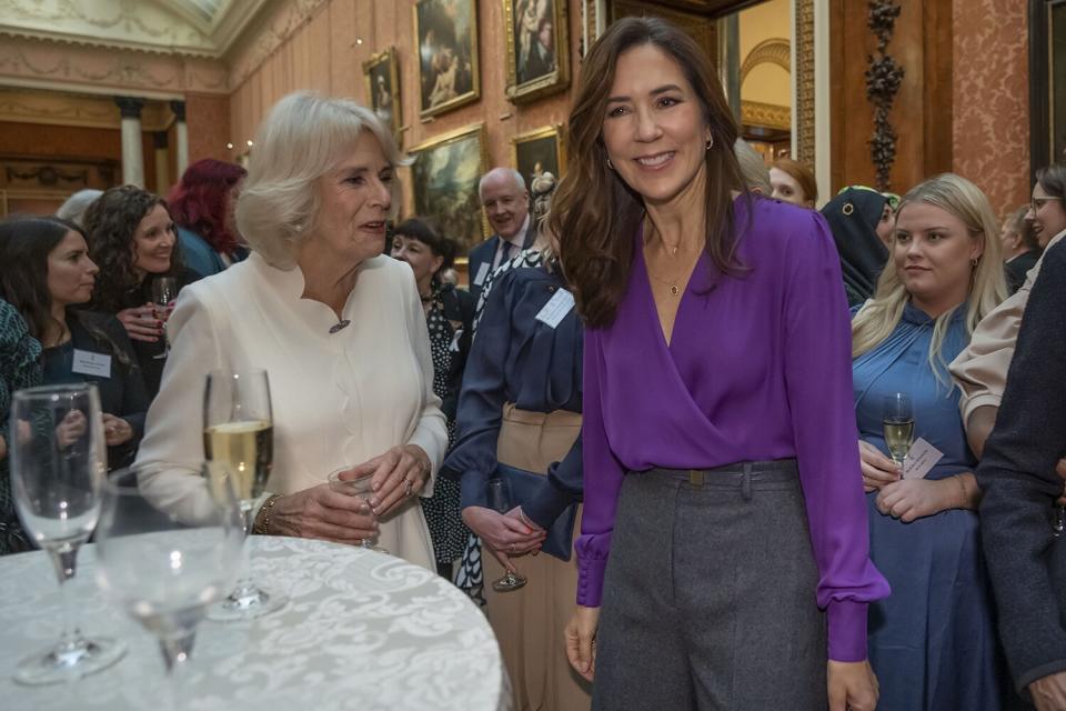 Camilla, The Queen Consort and Danish Crown Princess Mary attend a reception to raise awareness of violence against women and girls