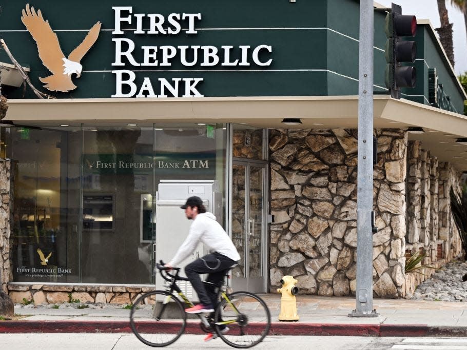 A man rides a bicycle past the First Republic Bank branch in Santa Monica, California.