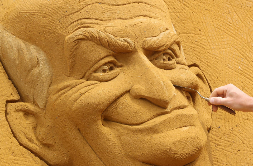 A sand carver works on a sculpture depicting French actor Louis de Funes, during the Sand Sculpture Festival "Dreams" in Ostend, Belgium June 18, 2019. (Photo: Yves Herman/Reuters)