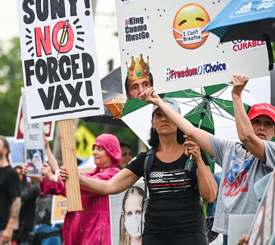 A crowd protesting mandatory masks and vaccines forms before a school board meeting at a high school in Kings Park, New York on June 8. (Steve Pfost/Newsday RM via Getty Images)