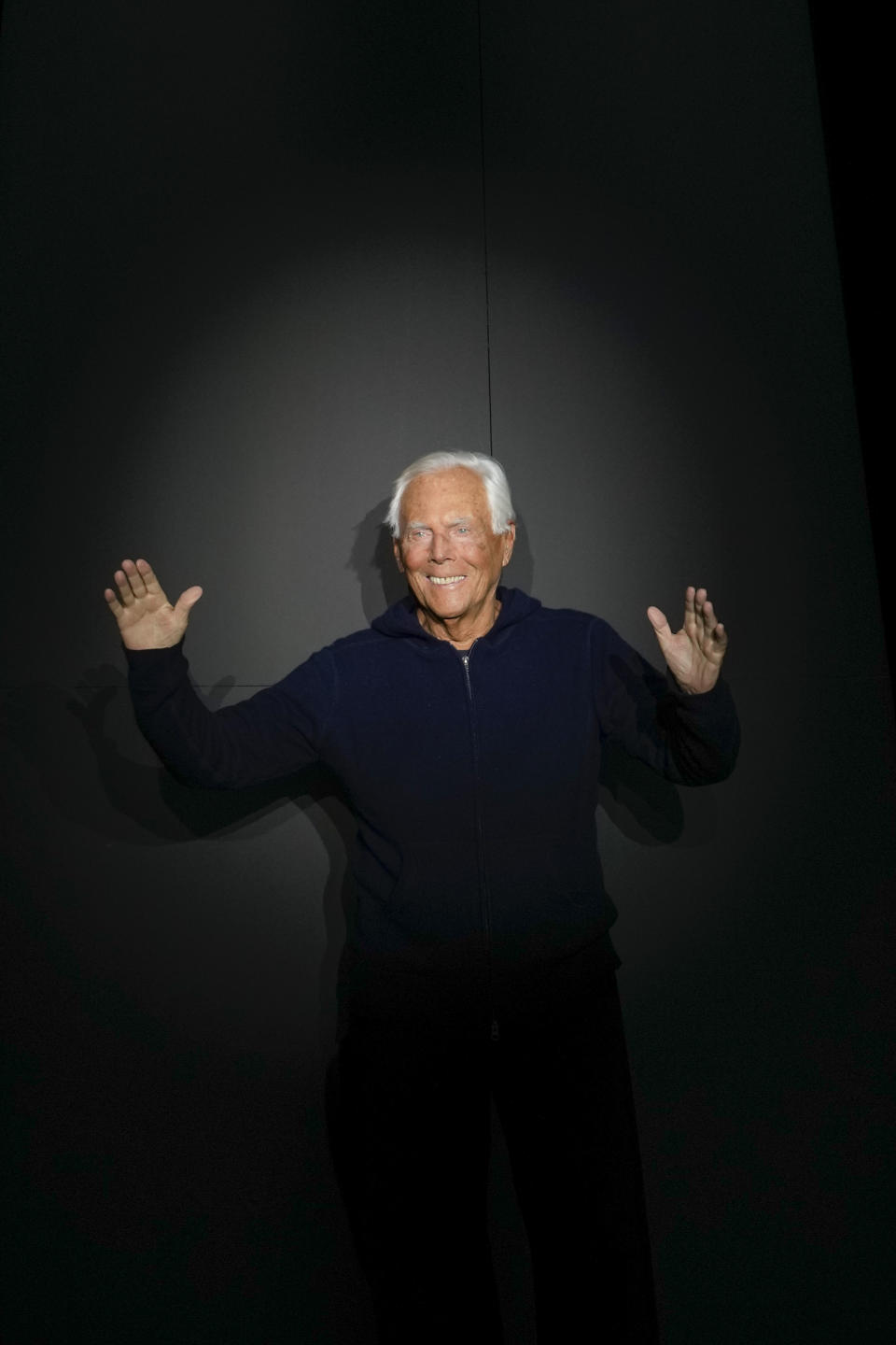 Designer Giorgio Armani accepts applause after the men's Giorgio Armani Fall-Winter 2024-2025 collection, that was presented in Milan, Italy, Saturday, Jan. 13, 2024. (AP Photo/Luca Bruno).