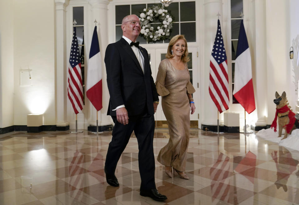 Louisiana Gov. John Bel Edwards and his wife Donna Edwards arrive for the State Dinner with President Joe Biden and French President Emmanuel Macron at the White House in Washington, Thursday, Dec. 1, 2022. (AP Photo/Susan Walsh)