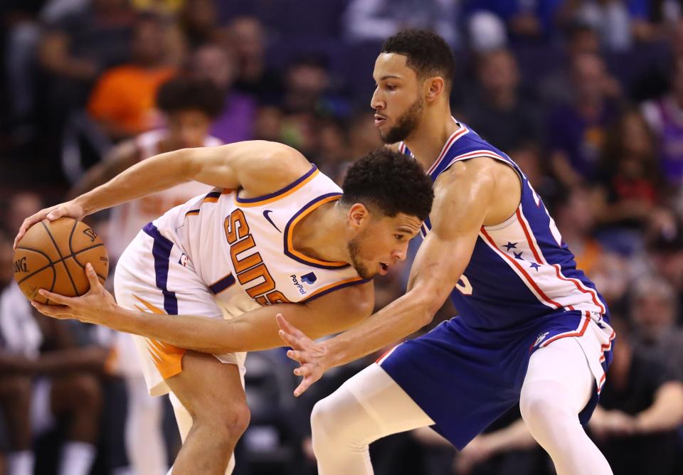 Phoenix Suns guard Devin Booker (left) against Philadelphia 76ers guard Ben Simmons both made headlines recently while playing video games.