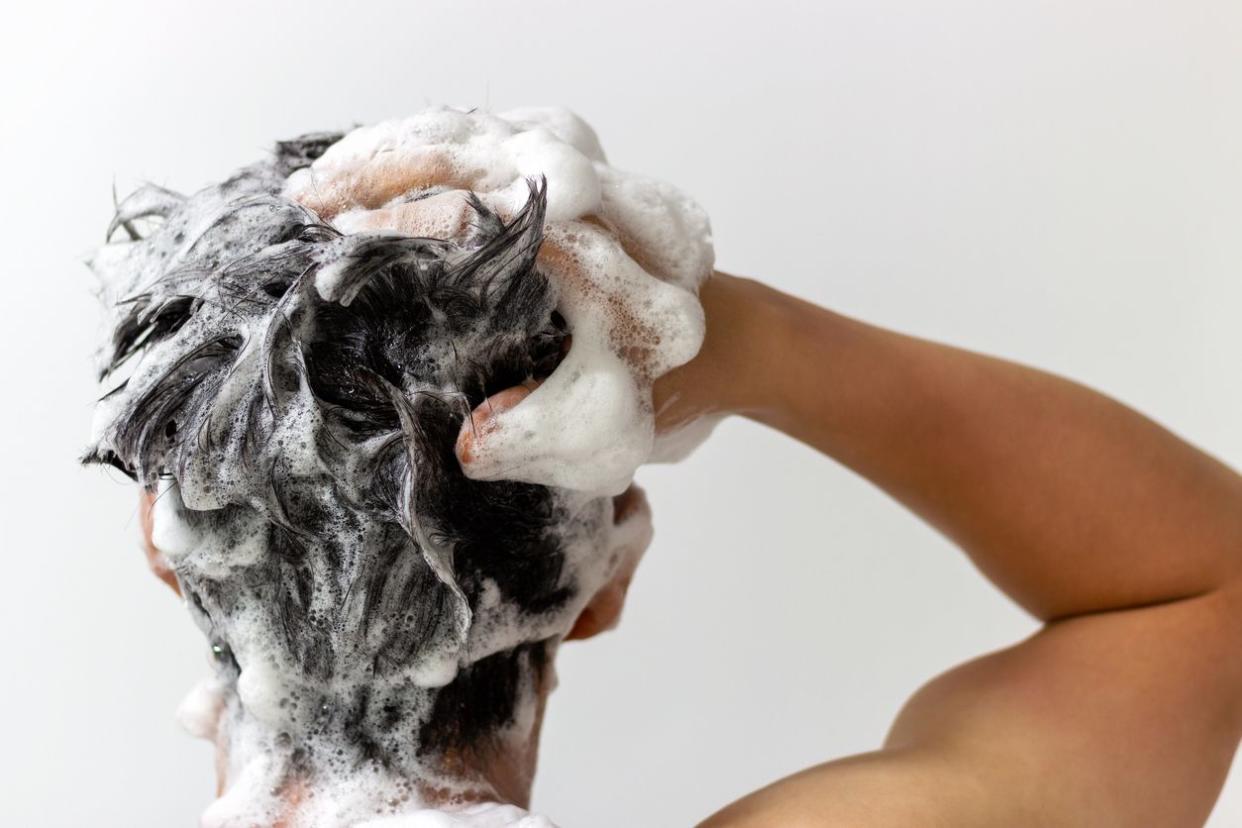 A man washes his head