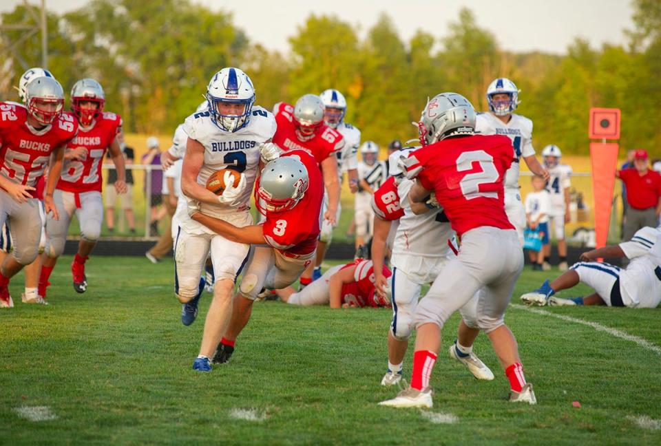 Crestline's Carter Jones is brought down by Buckeye Central's Heath Jensen.