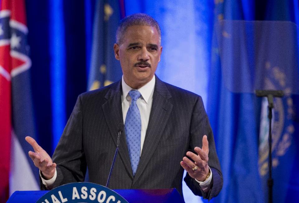 Attorney General Eric Holder speaks at the annual Attorneys General Winter Meeting in Washington, Tuesday, Feb. 25, 2014. Holder said state attorneys general are not obligated to defend laws in their states banning same sex-marriage if they don't believe in them. (AP Photo/Manuel Balce Ceneta)
