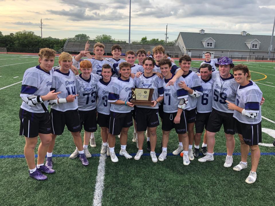 The Rumson-Fair Haven senior class takes a moment with the trophy. Rumson-Fair Haven defeats Summit in the NJSIAA Group 2 State Final on June 3, 2022 at Rumson-Fair Haven Regional High School