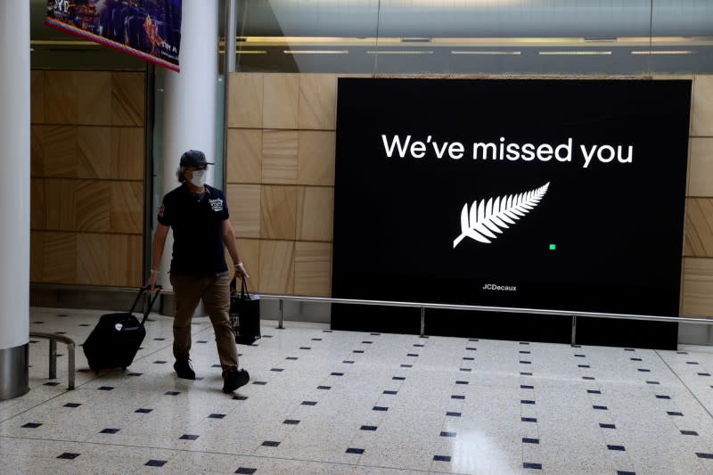 FILE PHOTO: Passengers arrive from New Zealand after the Trans-Tasman travel bubble opened overnight, at Sydney Airport