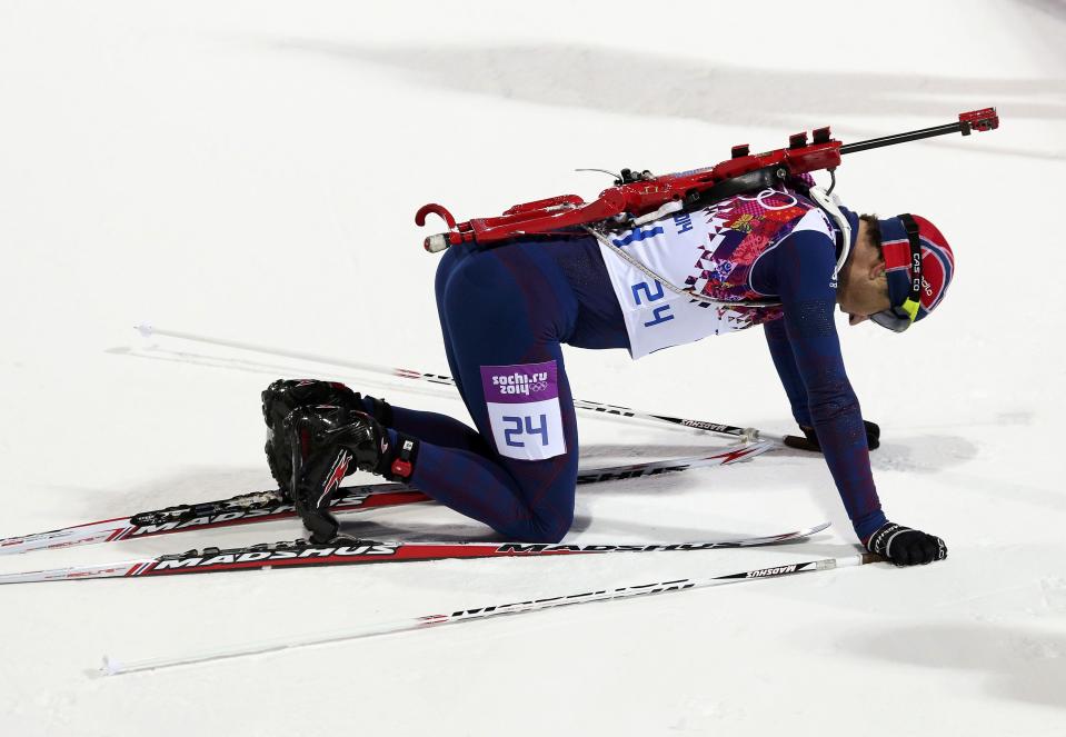 Winner Ole Einar Bjoerndalen of Norway reacts after competing in the men's biathlon 10 km sprint event at the Sochi 2014 Winter Olympics in Rosa Khutor February 8, 2014. REUTERS/Sergei Karpukhin (RUSSIA - Tags: SPORT BIATHLON OLYMPICS)