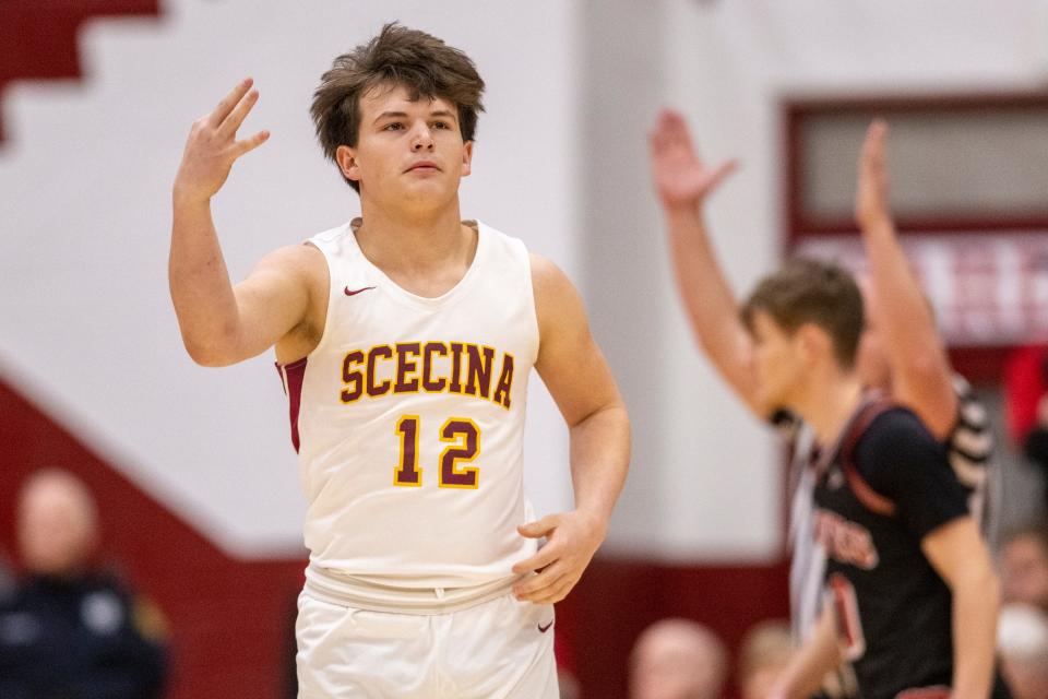 Indianapolis Scecina Memorial High School junior David Mendez (12) reacts after hitting a 3-point shot during the first half of an IHSAA Class 2A Semi-State semi-final basketball game against Brownstown Central High School, Saturday, March 18, 2023, at Southport High School.