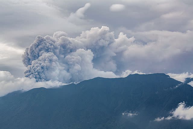 <p>ADI PRIMA/AFP via Getty Images</p> The volcano's eruption sent a 10,000-foot ash cloud into the air