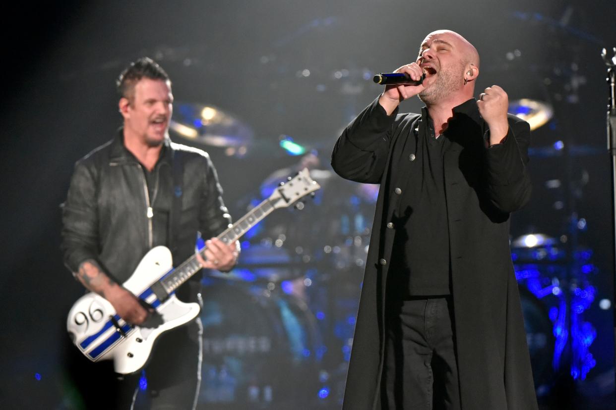 David Draiman, right, and Dan Donegan of the band Disturbed perform at the Allstate Arena in Rosemont, Ill. 