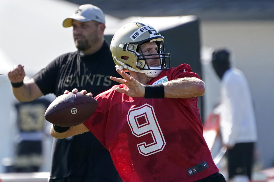 FILE - In this Aug. 22, 2020, file photo, New Orleans Saints quarterback Drew Brees (9) passes during practice at their NFL football training facility in Metairie, La. In the first matchup of 40-plus quarterbacks in NFL annals, during one of the most anticipated openers the league has seen _ though it won't be seen by fans at Raymond James Stadium due to the coronavirus pandemic _ Tom Brady makes his Buccaneers debut against that youngster Brees and the Saints. (AP Photo/Gerald Herbert, Pool, File)