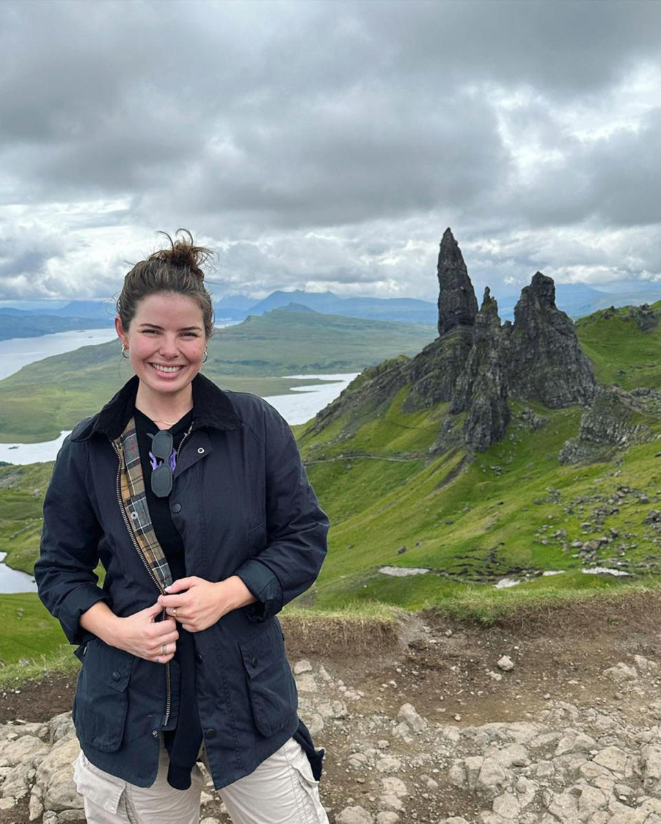 Olivia Frazer standing in front of a monument in Scotland