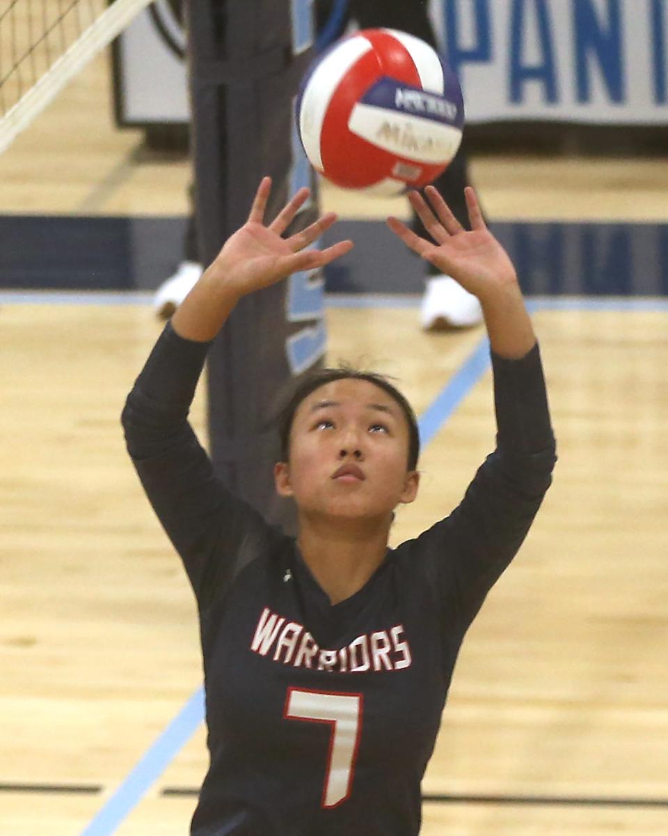 Lincoln-Sudbury's Joyce Li sets up a teammate in the second set of their match at Franklin High School on Tuesday, Sept. 26, 2023. Franklin would go on to win 3-0.