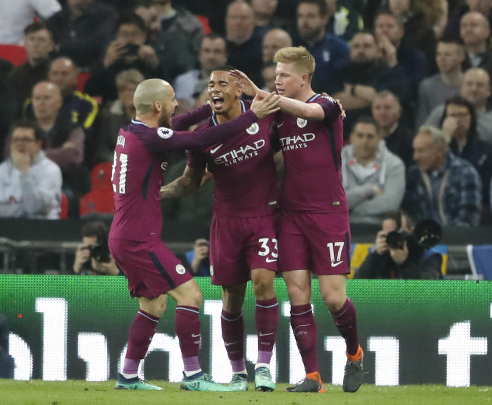 <p>Manchester City moved to within inches of landing the Premier League title in beating Tottenham 3-1 at Wembley on Saturday evening. Gabriel Jesus celebrates with Kevin De Bruyne (right), and David Silva, after scoring the opening goal. </p>