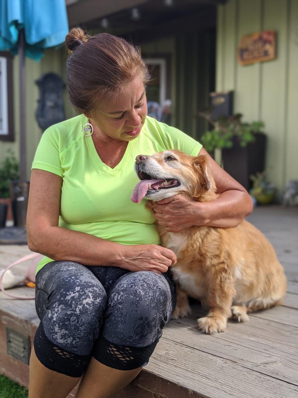 Sara Maicon with her dog Maggie, a dog she had to surrender to a senior dog sanctuary in San Diego County.