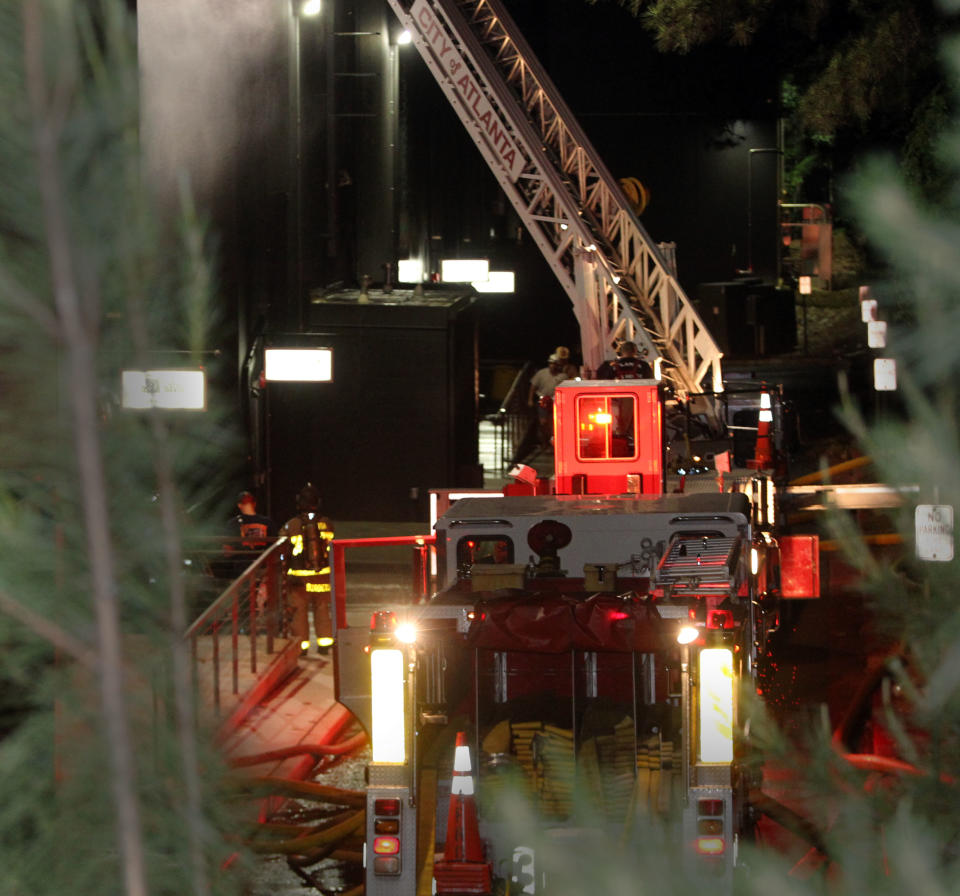 Atlanta firefighters were on the scene of a blaze Tuesday night at Tyler Perry Studios in southwest Atlanta. Atlanta fire officials say they have put out a 4-alarm blaze at Tyler Perry Studios that damaged a building at the complex. Atlanta Fire Department spokesman Capt. Jolyon Bundrige says there were no reports of injuries from the fire that started before 9 p.m. Tuesday. Officials said in a news release it was extinguished about an hour later. (AP Photo/Curtis Compton, Atlanta Journal Constitution)