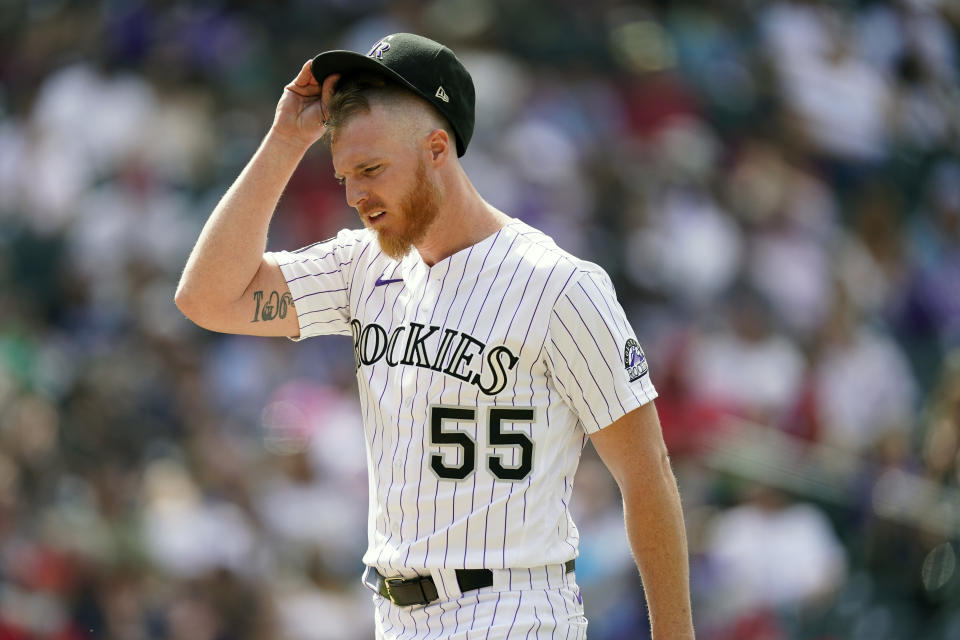 Colorado Rockies starting pitcher Jon Gray adjusts his cap as he heads to the dugout after retiring Philadelphia Phillies' Alec Bohm for the final out in the top of the sixth inning of a baseball game Sunday, April 25, 2021, in Denver. (AP Photo/David Zalubowski)