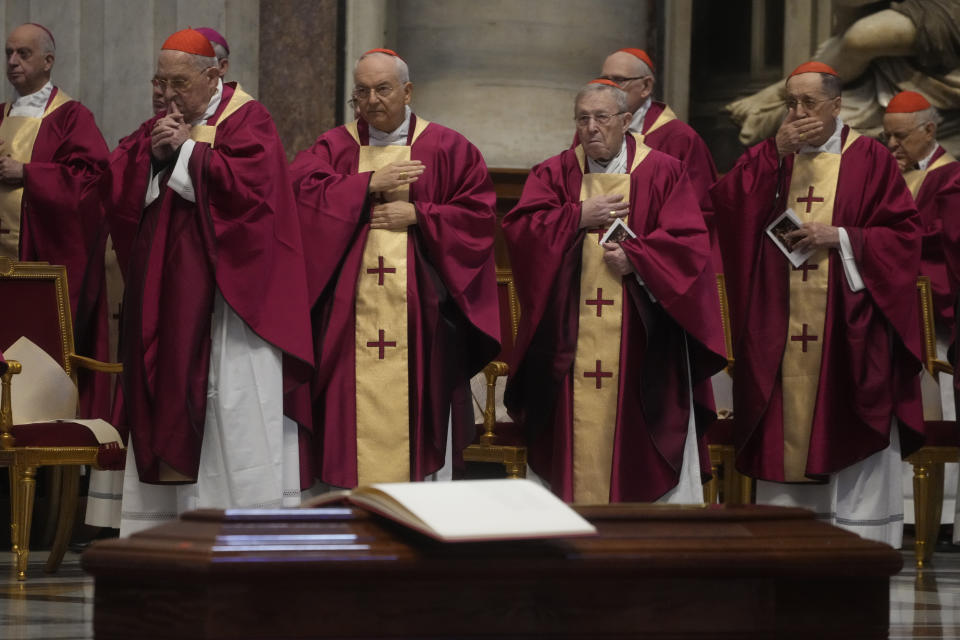 Cardinals and bishops pray during the funeral ceremony of Australian Cardinal George Pell in St. Peter's Basilica at the Vatican, Saturday Jan. 14, 2023. Cardinal Pell died on Tuesday at a Rome hospital of heart complications following hip surgery. He was 81. (AP Photo/Gregorio Borgia)