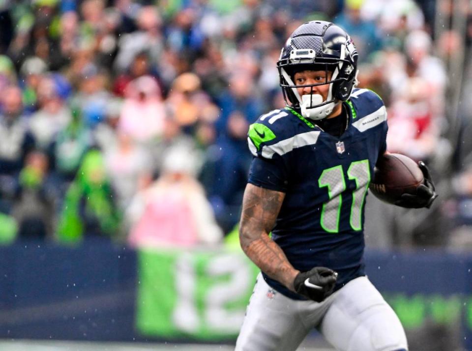 Seattle Seahawks wide receiver Jaxon Smith-Njigba (11) picks up from yards after the catch during the first quarter of the game against the Washington Commanders at Lumen Field, on Sunday, Nov. 12, 2023, in Seattle, Wash.