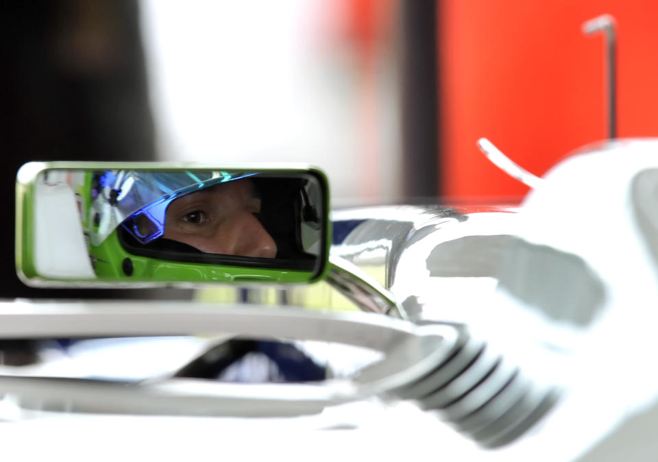 Simona De Silvestro, of Switzerland, is seen in a rearview mirror of a Sauber F1 2012 during a training session at Ferrari's Fiorano test track, near Modena, Italy, Saturday, April 26, 2014. Simona de Silvestro is an affiliated driver with Sauber this year with a goal of competing for a Formula One seat in 2015. The Swiss driver has spent the last four years racing in IndyCar, and scored her first career podium in October with a second-place finish at Houston. It was the first podium finish for a woman on a road course in IndyCar. The 25-year-old De Silvestro has been spending this year testing, participating in simulator training and preparing for the mental and physical demands of F1. Sauber says the goal is to help De Silvestro earn her F1 super license and prepare for a seat in 2015. (AP Photo/Marco Vasini)