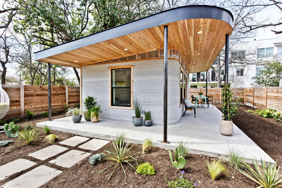 This photo provided by ICON shows a 3D home in Austin, Texas. A new generation of startups wants to disrupt the way houses are built by automating production with industrial 3D printers. (Regan Morton Photography/Courtesy of ICON via AP)