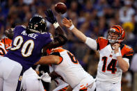 Quarterback Andy Dalton #14 of the Cincinnati Bengals passes the ball in the first half against the defensive end Pernell McPhee #90 of the Baltimore Ravens at M&T Bank Stadium on September 10, 2012 in Baltimore, Maryland. (Photo by Rob Carr/Getty Images)